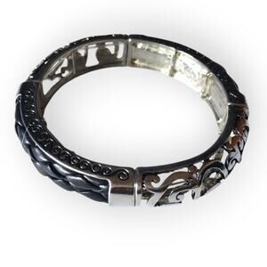 Braided black faux leather and scrollwork cut silver tone stretch bracelet